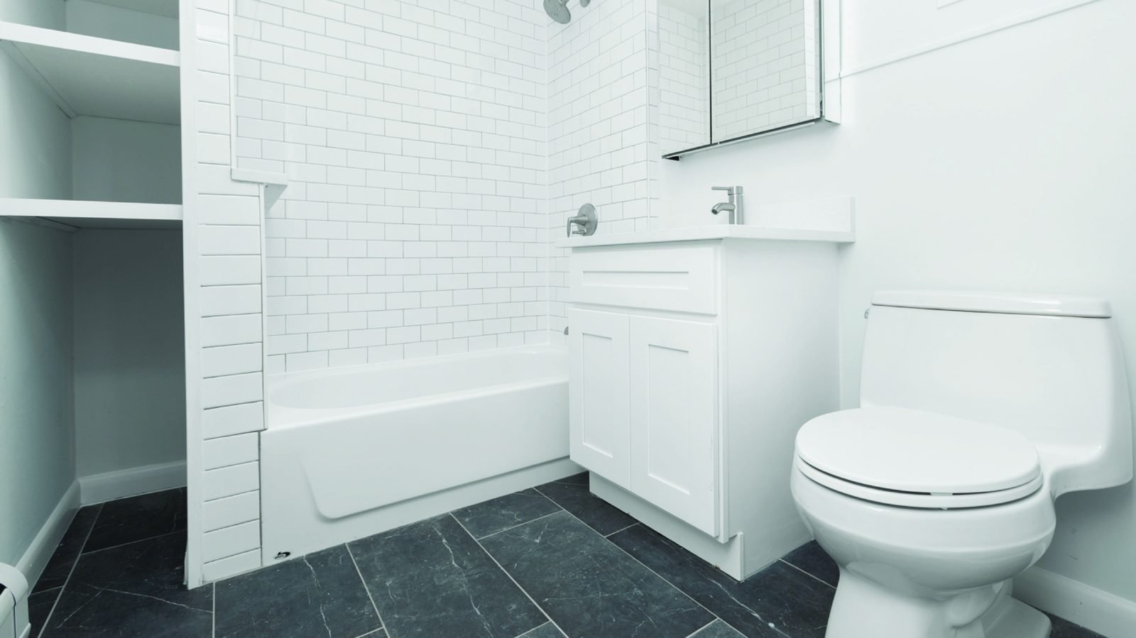 Remodeled bathroom with tile surround